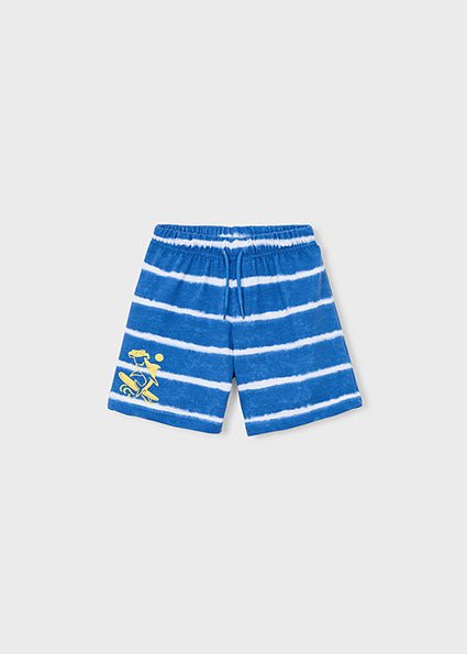 Mayoral Blue and white tie dye striped boys’ shorts with elastic waistband and yellow graphic of a surfing shark wearing sunglasses.