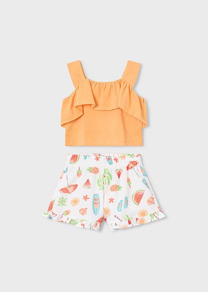 Two-piece girls’ summer outfit with orange ruffled top and white printed shorts featuring playful summer icons.