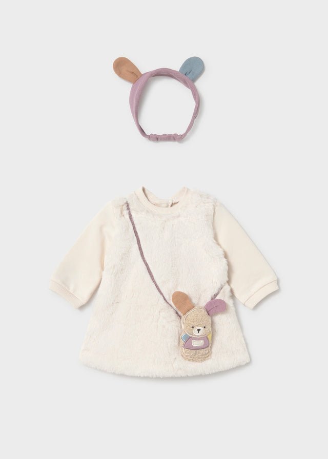 A baby girl's two-piece outfit set featuring a cream-colored fuzzy long-sleeve dress with a bunny-themed crossbody bag and a matching lavender headband with tan and blue bunny ears, displayed on a light gray background.