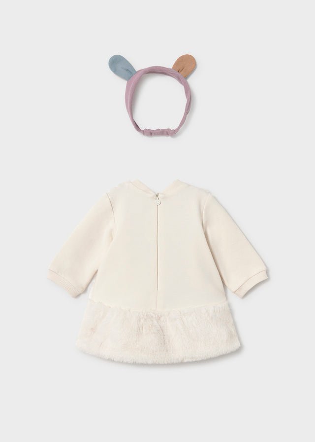 Baby girl's two-piece outfit set featuring a cream-colored long-sleeve cardigan with a ruffled hem and a matching lavender bunny-ear headband.