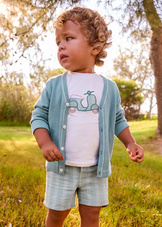 Little boy wearing Mayoral boys shorts and t-shirt set with vespa design on the t-shirt 