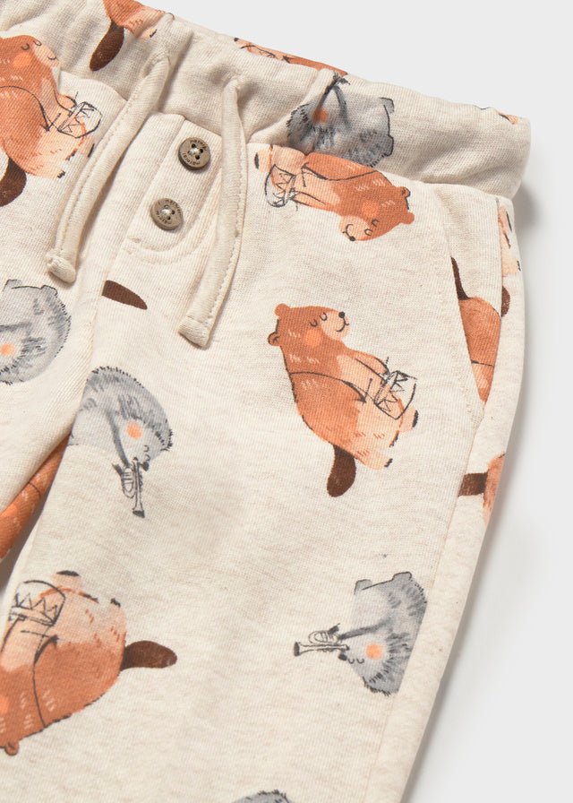  Light Tofu baby trousers with a subtle woodland print and long‑leg design.