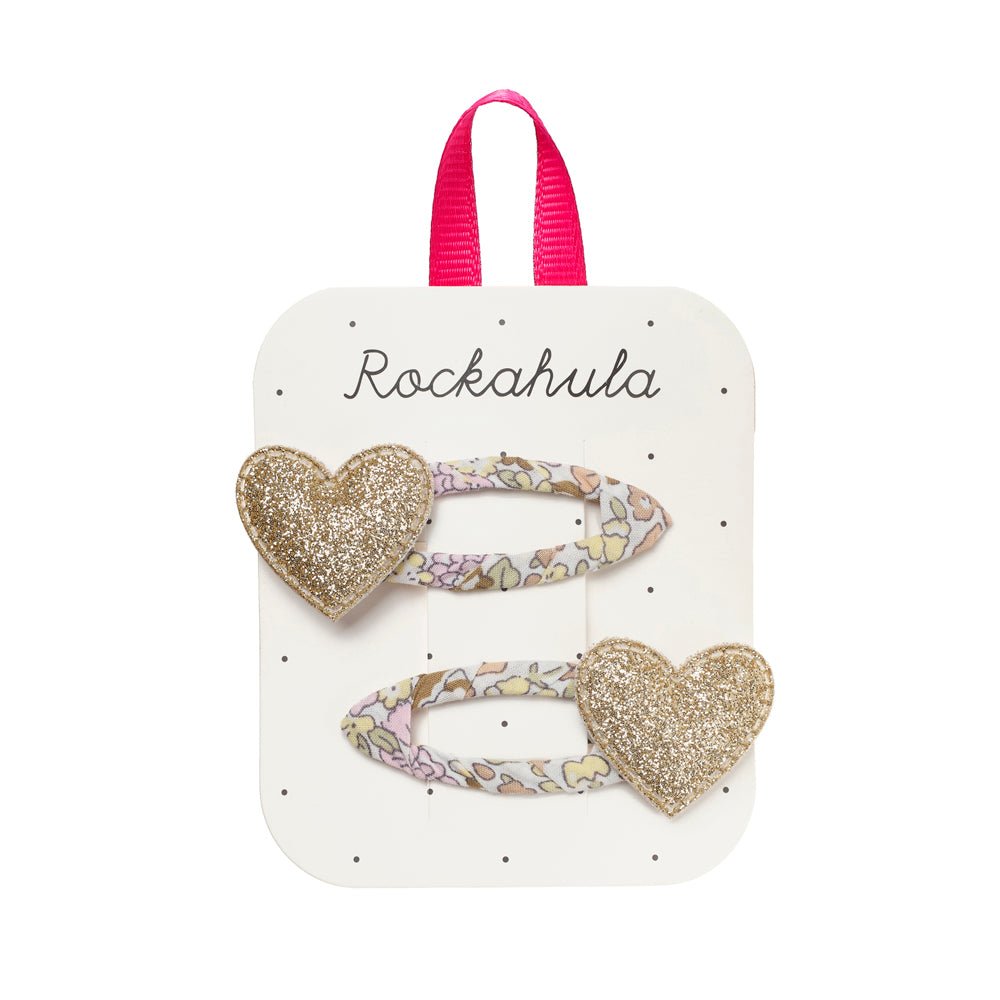 Heart-shaped hair clips on a Rockahula branded card with a pink ribbon.